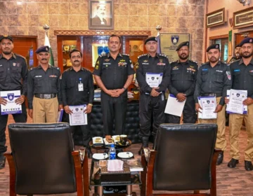 DIG Security Dr. Maqsood Ahmed distributing appreciation certificates among Karachi Police officers