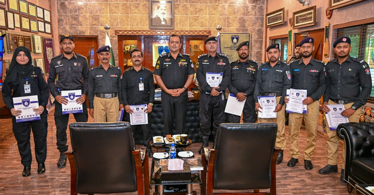 DIG Security Dr. Maqsood Ahmed distributing appreciation certificates among Karachi Police officers