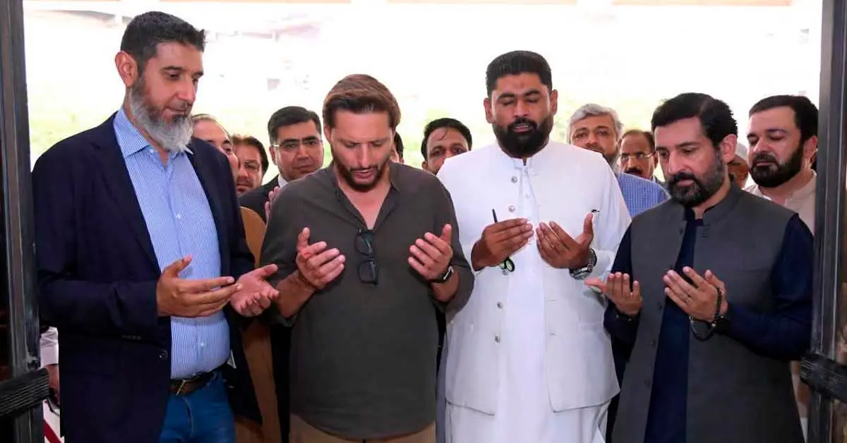 Former cricketer Shahid Afridi receiving a shield at the inauguration of the National Institute of Leather Technology in Karachi.