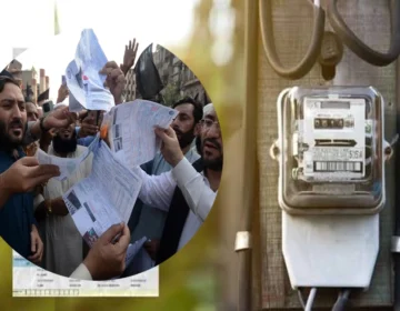 An electricity utility bill document placed on table showing tax Breakdown in Pakistan