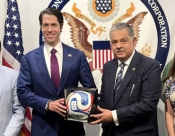 Pakistani Ambassador Rizwan Saeed Sheikh presenting official FIFA football to DFC CEO in Washington