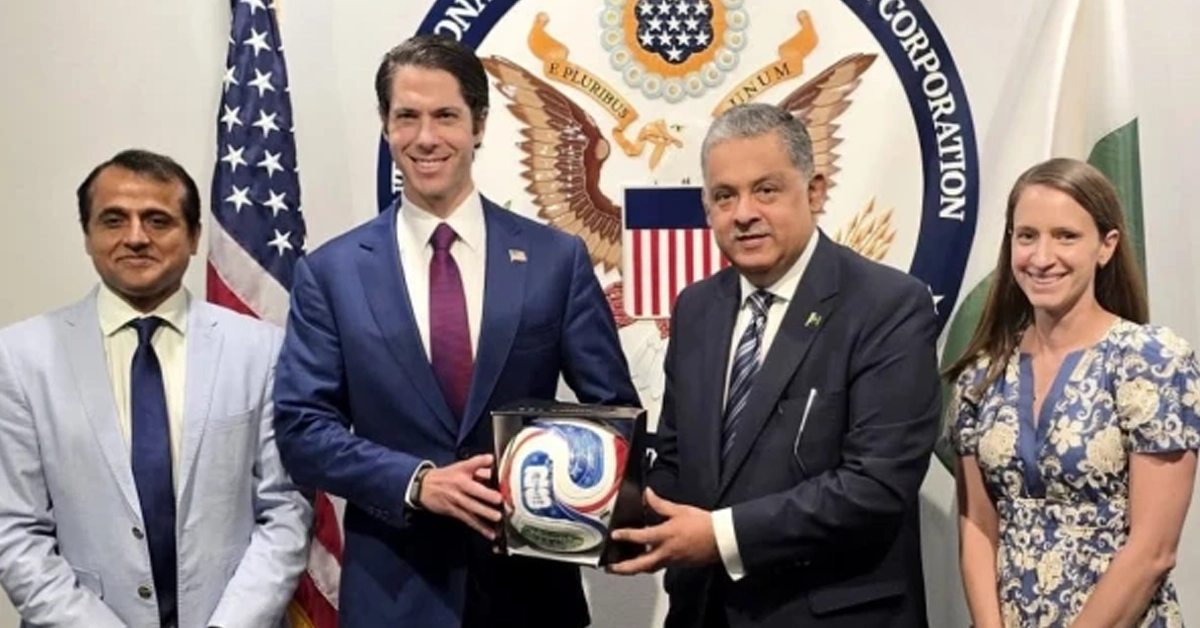 Pakistani Ambassador Rizwan Saeed Sheikh presenting official FIFA football to DFC CEO in Washington