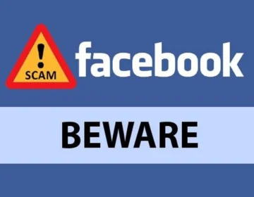 A cyber criminal tracking personal data from a social media profile on a computer screen.