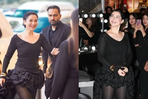 Pakistani actress Hania Amir posing in a bold black western outfit at a luxury brand launch event.