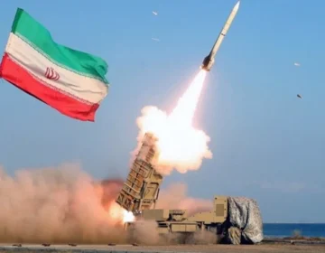 Ballistic missiles launched into the night sky aiming at military targets during Middle East conflict.
