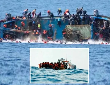 A crowded and unsafe migrant boat stranded at sea under high waves during an illegal crossing attempt.