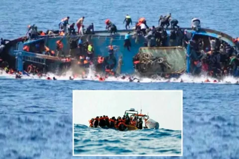 A crowded and unsafe migrant boat stranded at sea under high waves during an illegal crossing attempt.