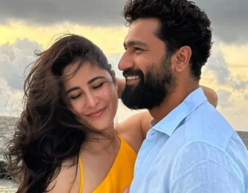 Bollywood actors Vicky Kaushal and Katrina Kaif posing together and smiling representing their close bond