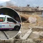 Rescue 1122 workers clearing the debris of a collapsed house in Kohat after heavy rains