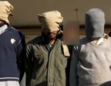 Counter Terrorism Department (CTD) police officials presenting seized explosive materials and weapons at a press conference in Karachi.