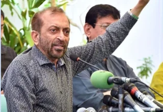MQM leader Dr. Farooq Sattar talking to media personnel at a press conference in Karachi.