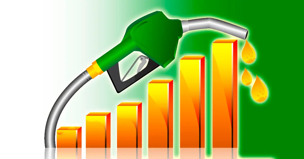 A fuel nozzle dispensing petrol at a local gas station in Pakistan with updated pricing.