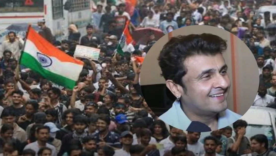 Playback singer Sonu Nigam singing live holding a microphone on stage during concert performance