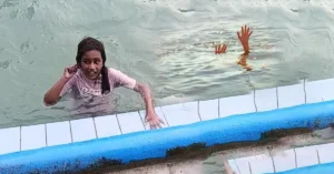 Lahore police team investigating the open drain hole in a public swimming pool area