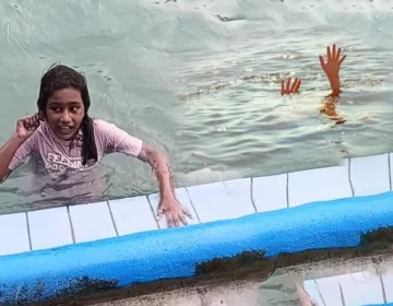 Lahore police team investigating the open drain hole in a public swimming pool area