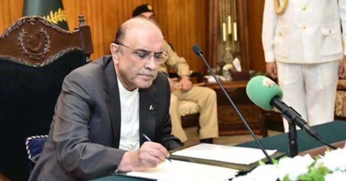 President of Pakistan Asif Ali Zardari signing official state summaries at Aiwan-e-Sadr