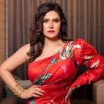 Zareen Khan responding to a media person at a brand promotional event