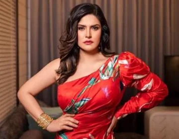 Zareen Khan responding to a media person at a brand promotional event