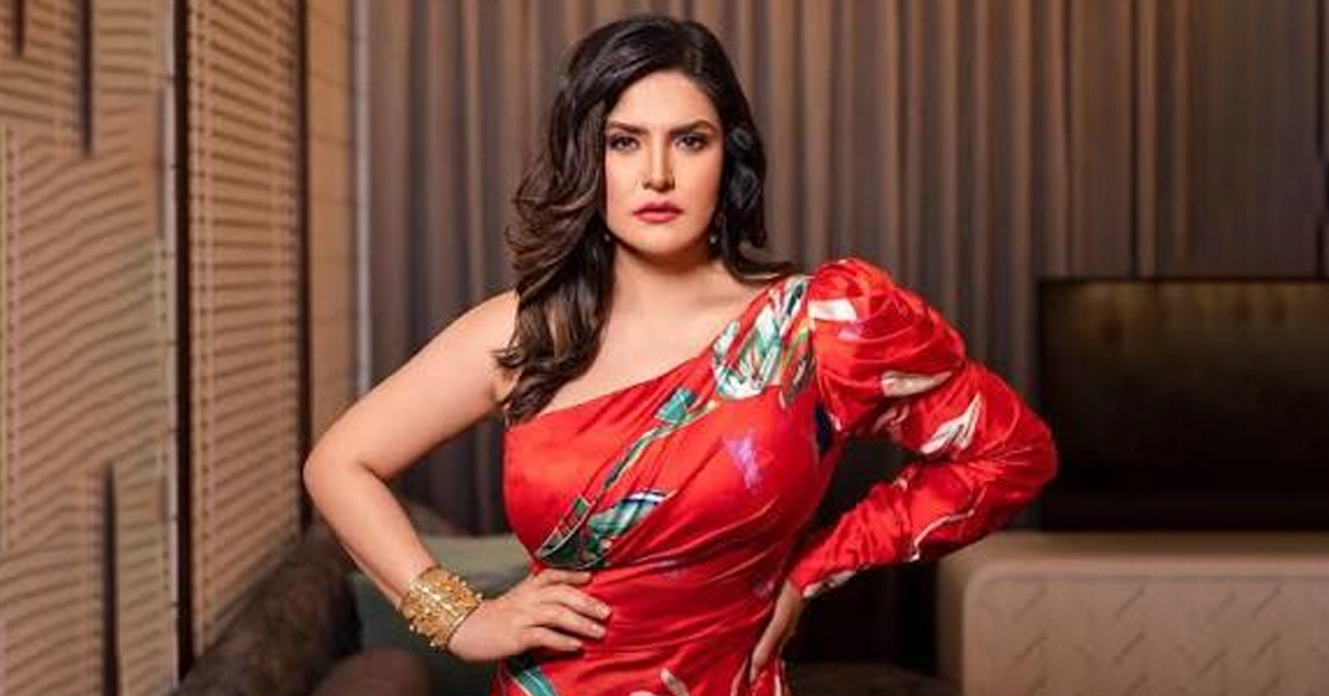 Zareen Khan responding to a media person at a brand promotional event