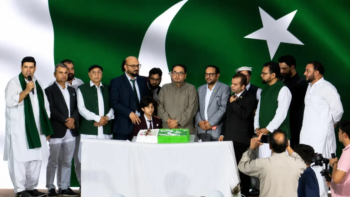 A sleek visual graphic depicting a white crescent and star representing overseas Pakistani Independence Day celebration in UAE without text