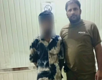 Lahore police arresting an accused involved in harassing women in Shadbagh area