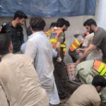 Rescue 1122 team and emergency disaster vehicles responding to the school roof collapse site in Peshawar