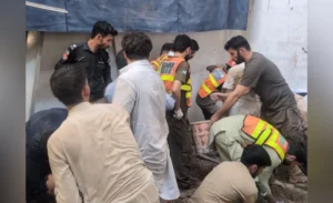Rescue 1122 team and emergency disaster vehicles responding to the school roof collapse site in Peshawar