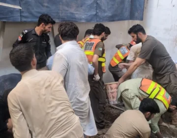 Rescue 1122 team and emergency disaster vehicles responding to the school roof collapse site in Peshawar